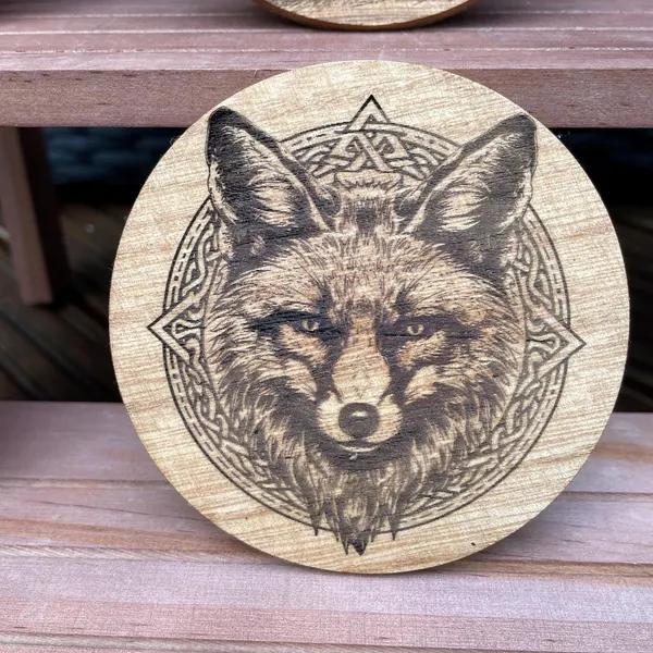 Celtic fox design engraved on wood round
